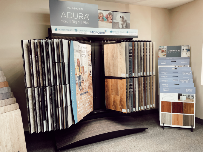 Floorscapes flooring showroom featuring a mannington flooring display